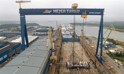 The keel of HERO OF THE SEAS being laid, with STAR OF THE SEAS in front