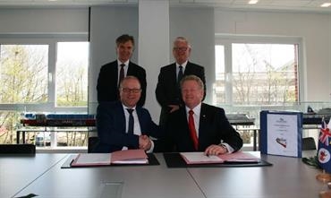 Contract signing with Eystein Eriksrud, Siem Shipping (back left), Bernard Dwyer, TT-Line Company Pty Ltd (back right), Rüdiger Fuchs, FSG (front left) and Mike Grainger, TT-Line Company Pty Ltd (front right) © FSG