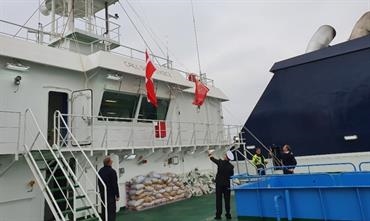 The Chinese flag is lowered, the Danish one is hoisted - DFDS took delivery of its fourth mega-freighter built by Jinling. © DFDS