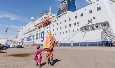 Amadou and his caregiver going on board GLOBAL MERCY in Dakar © Mercy Ships